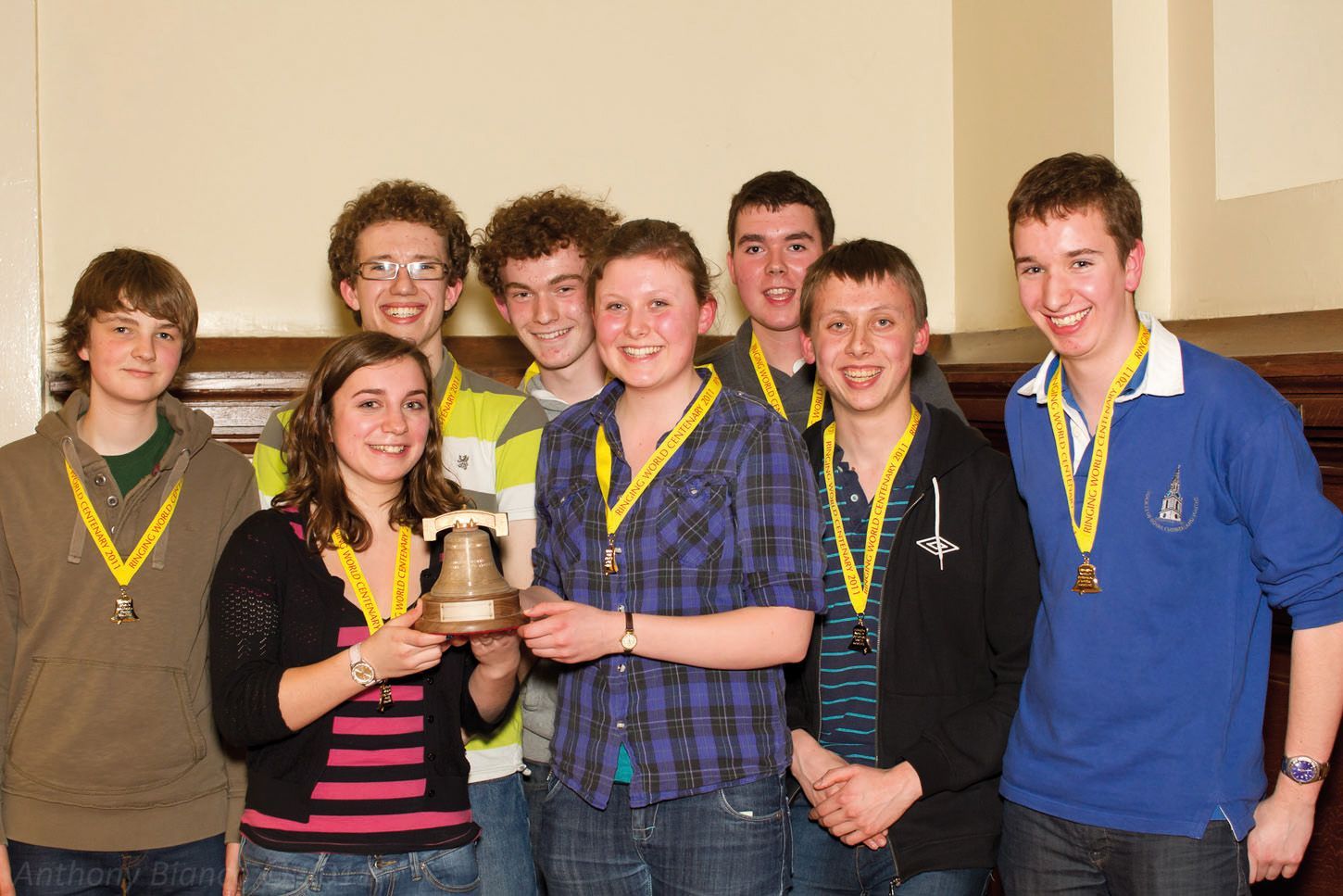 The winning Hertfordshire band at the 2011 Ringing World National Youth Contest: eight teenage ringers in Ringing World Centenary medals, two of them holding the bell-shaped trophy.